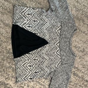Sweater top with sheer triangle black back.